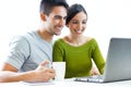 Happy young couple browsing internet at home Royalty Free Stock Photo