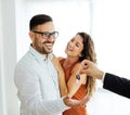 young couple new house keys buy real estate home agent agreement investment apartment owner property Royalty Free Stock Photo