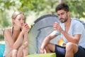 Happy young couple camping drinkig coke Royalty Free Stock Photo