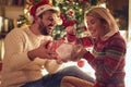 Happy young couple celebrating Christmas and having fun Royalty Free Stock Photo