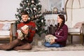 Happy young couple celebrating Christmas Royalty Free Stock Photo