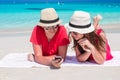 Happy young couple with cell phone on tropical Royalty Free Stock Photo