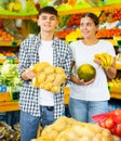 Happy young couple chooses products Royalty Free Stock Photo