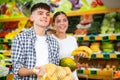 Happy young couple chooses products Royalty Free Stock Photo