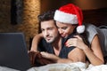 Happy young couple christmas shopping online Royalty Free Stock Photo