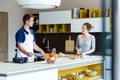 Happy young couple cooking together in the kitchen at home. Royalty Free Stock Photo