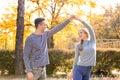 Happy young couple dancing in autumn park Royalty Free Stock Photo