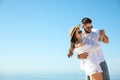 Happy couple dancing at beach near sea. Honeymoon trip Royalty Free Stock Photo