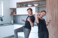 Happy young couple dancing in their new kitchen. Royalty Free Stock Photo