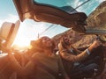 Happy young couple doing road trip in tropical city - Travel people having fun driving in trendy convertible car Royalty Free Stock Photo