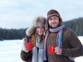 Happy young couple drink warm tea at winter Royalty Free Stock Photo