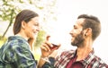 Happy young couple drinking red wine at vineyard farmhouse Royalty Free Stock Photo