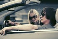 Happy young couple driving convertible car Royalty Free Stock Photo