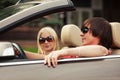 Happy young couple driving convertible car Royalty Free Stock Photo
