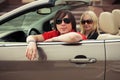 Happy young couple driving convertible car Royalty Free Stock Photo