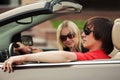 Happy young couple driving convertible car Royalty Free Stock Photo