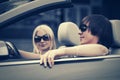 Happy young couple driving convertible car Royalty Free Stock Photo