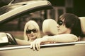 Happy young couple driving convertible car Royalty Free Stock Photo