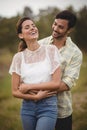 Happy young couple embracing at farm Royalty Free Stock Photo