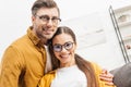 happy young couple embracing at home and looking Royalty Free Stock Photo