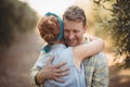 Happy young couple embracing at olive farm Royalty Free Stock Photo