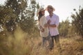 Happy young couple embracing at olive farm Royalty Free Stock Photo