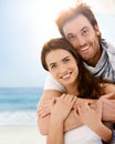 Happy young couple embracing on summer beach Royalty Free Stock Photo