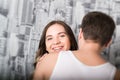 Happy young couple enjoying an intimate moment, laughing a lot and man gently strokes his partner's hair Royalty Free Stock Photo