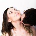 Happy young couple enjoying an intimate moment, laughing a lot and man gently strokes his partner's hair