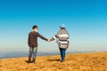 Happy young couple enjoying nature at mountain peak. Love, feelings and relationship. Couple in love on vacation Royalty Free Stock Photo