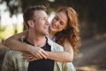 Happy young couple enjoying at olive farm on sunny day Royalty Free Stock Photo