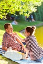 Happy young couple enjoying picnic. Toned image Royalty Free Stock Photo