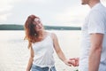 Happy young couple enjoying a solitary beach backriding