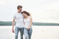 Happy young couple enjoying a solitary beach backriding