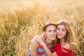 Happy young couple enjoying in the wheat field, summer season. Sunset light, flare light, copy space Royalty Free Stock Photo