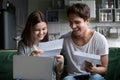 Happy young couple excited by reading good news in letter