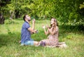 Happy young couple expecting baby, pregnant woman with husband blowing bubbles and laughing Royalty Free Stock Photo