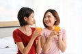 Happy young couple friend beautiful asia women drinking orange juice enjoying fruit refreshment ,Healthy lifestyle concept. Royalty Free Stock Photo