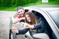 Happy young couple, friends making selfie while sitting in car. Summer time. Caucasian people. Concept of transportation.