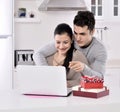 Happy young couple with gift boxes Royalty Free Stock Photo