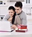 Happy young couple with gift boxes Royalty Free Stock Photo