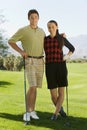 Happy Young Couple On Golf Course Royalty Free Stock Photo