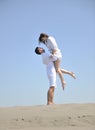 Happy young couple have fun on beach Royalty Free Stock Photo