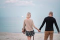 Happy young couple have fun on the beach, holding hands. Royalty Free Stock Photo