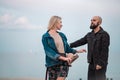 Happy young couple have fun on the beach, holding hands. Royalty Free Stock Photo