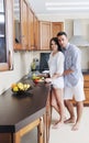 Happy young couple have fun in modern kitchen Royalty Free Stock Photo