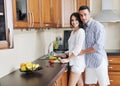 Happy young couple have fun in modern kitchen Royalty Free Stock Photo