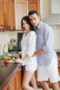 Happy young couple have fun in modern kitchen Royalty Free Stock Photo