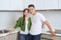 Happy young couple have fun in modern kitchen indoor Royalty Free Stock Photo