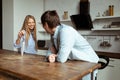 Happy young couple have fun in modern kitchen indoor Royalty Free Stock Photo